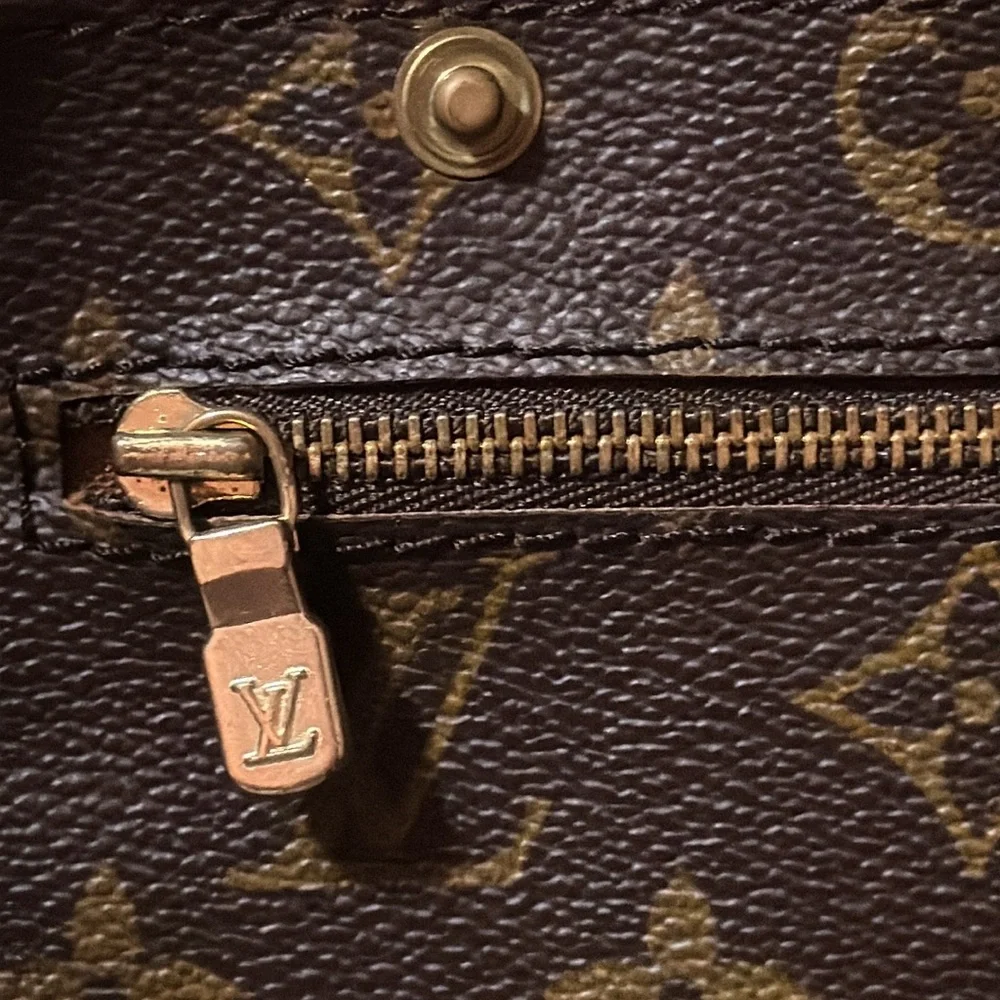 Louis Vuitton Monogram Randonnee GM snap pocket Clutch